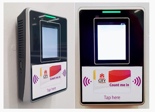 A small wall-mounted box. There is a display screen top front, and card reader location bottom front, with the words 'Tap here' and a colour image of a City ID card.